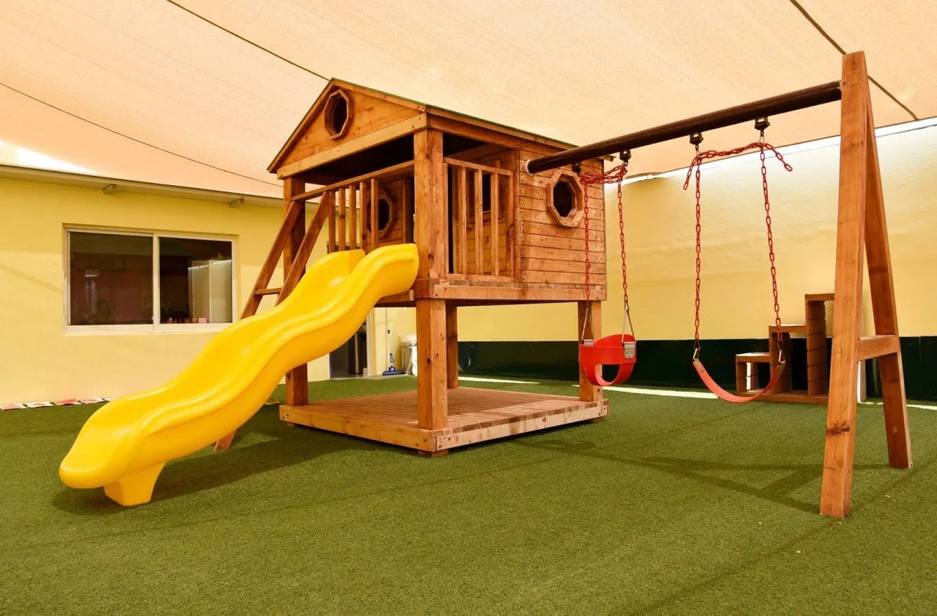 Indoor playground with slide and swings